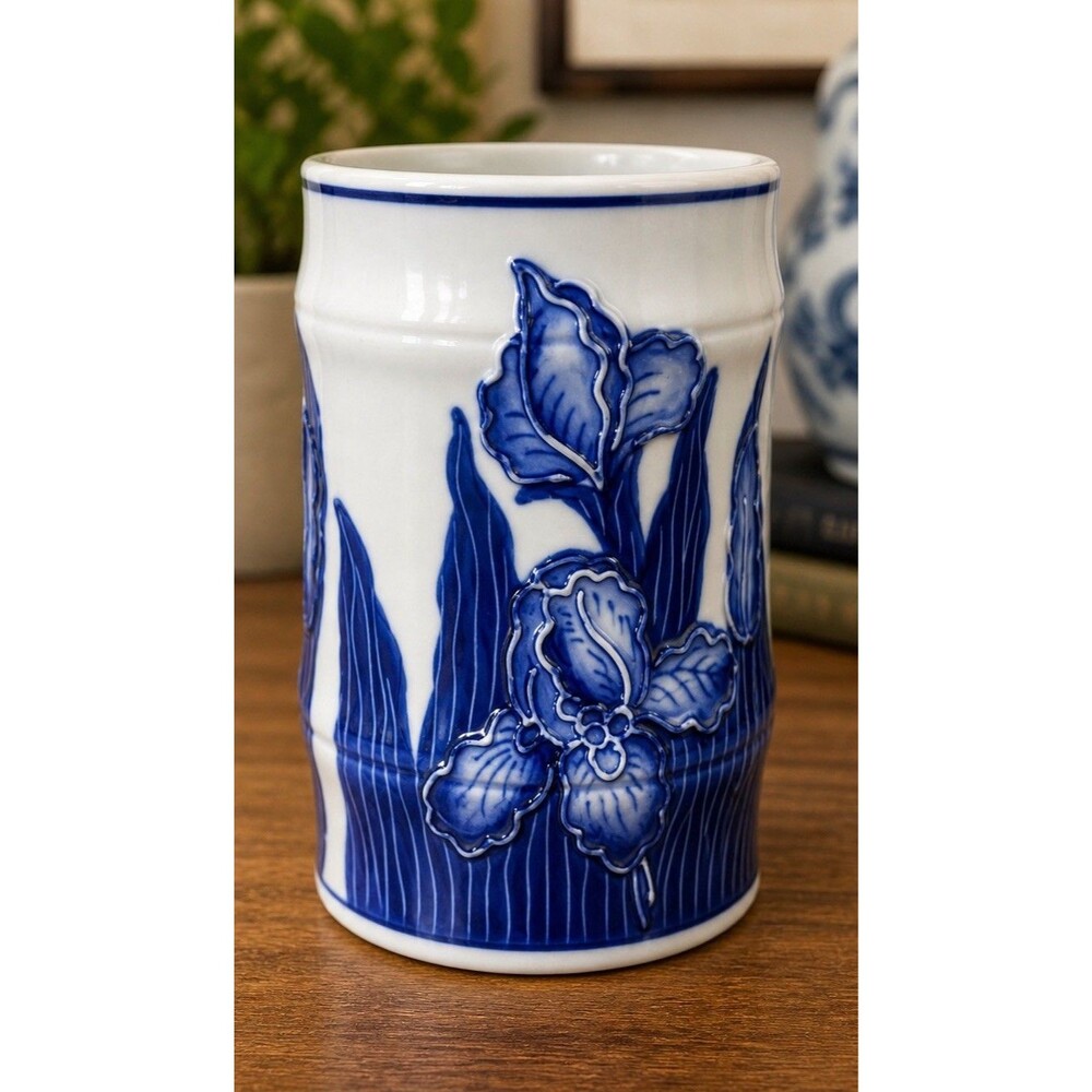 vintage blue and white ceramic vase featuring embossed iris